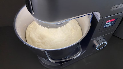 The yeast dough after rising. By the way, the bowl is so brightly lit because there is a light ring in the mixing arm.