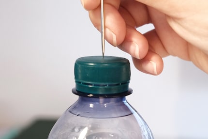 Perforating works great with a thick needle. However, an awl, a sharp knife or a screwdriver should also do the trick.