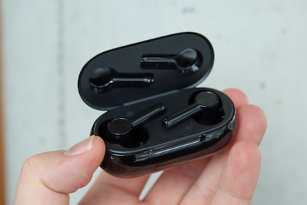 The OnePlus Buds Z2 in their charging case.