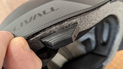 The loudspeaker and microphone are in the black plastic block underneath the gap.