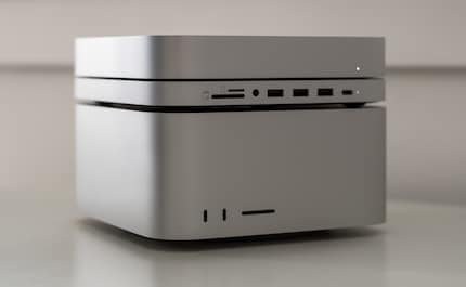 The Mac Mini with its dock is joined by a Mac Studio. Fortunately, these things are stackable.