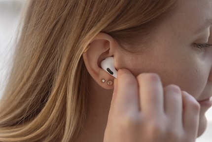 You press the AirPods Pro gently to activate the controls.