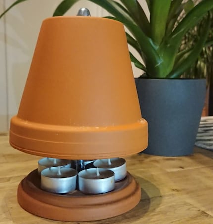 You can build tea-light heaters like these yourself or buy any number of varieties on DIY platforms like Etsy.