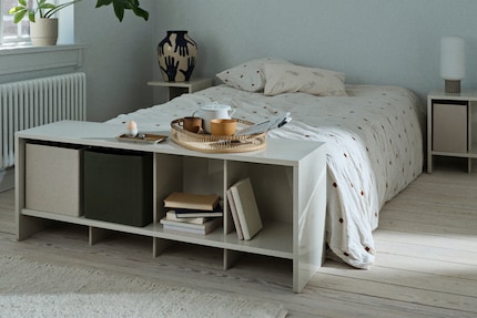 Een dressoir staat mooi tegen de muur, maar ook aan het voeteneind van het bed.