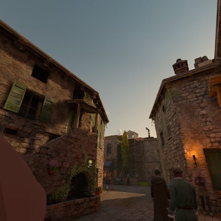 Monteriggioni: het stadje ziet er levendig uit. Links in beeld zie je het puntje van Ezio's neus.