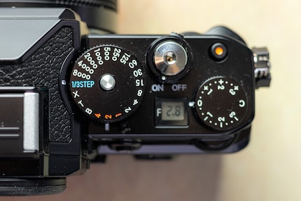 1/3 step means that you choose the time on the rear dial. There’s no automatic position on the shutter dial.