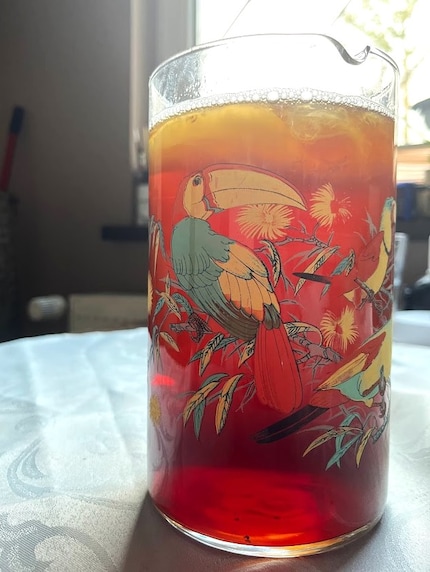 After fermentation, the liquid looks almost the same as before fermentation. The only difference is that the SCOBY has grown.