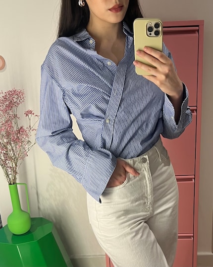 The blouse looks different when buttoned diagonally instead of straight.
