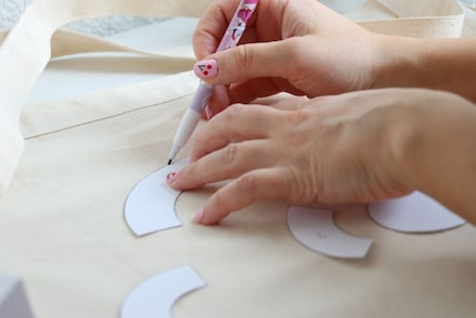I transfer the cut-out shapes onto the fabric with a pencil.