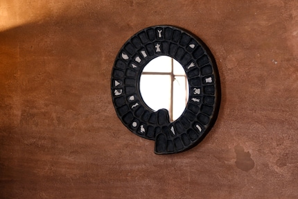 Inspired by Game of the Goose: the «Jogo do Ganso» mirror is made of brass, with an artificially created patina.