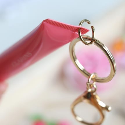 Then I thread a connecting ring through it.