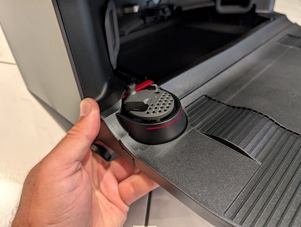 This small cleaning station cleans the mini mop.