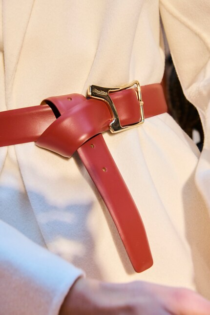 A knot makes extra-long belts look stylish.