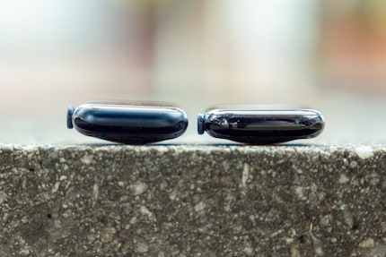 Apple’s latest smartwatch (right) next to its predecessor. Even though it’s hard to see in the photo, the new one is noticeably flatter.