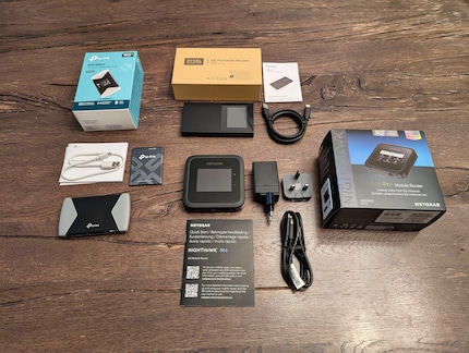 All three models with every accessory. Netgear is the only manufacturer to supply a charger.