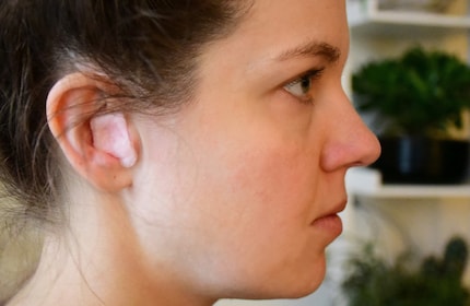 The cotton wool-covered wax fills all the space inside the cup-shaped part of my ear.