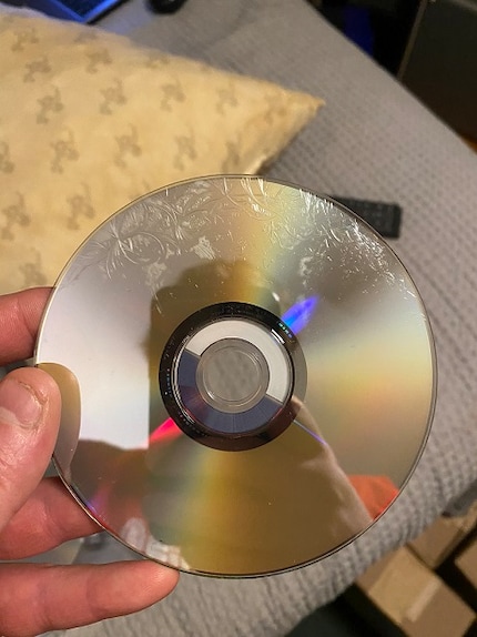 User rggkjg1 from the Animesuperhero forum shows his damaged DVD of the Superman Ultimate Collector's Edition.