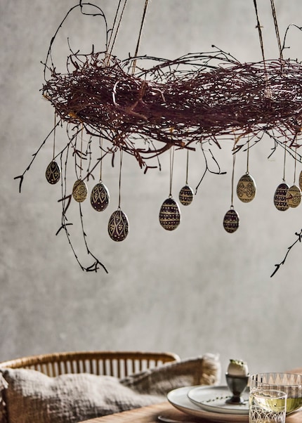 A simple twig wreath with subtle Easter decorations adds casual elegance to your decor.
