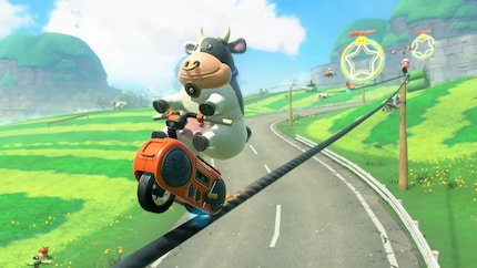 Une vache sur un lecteur de cassettes sur un fil électrique. Logique.