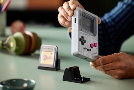 The Lego model of the Game Boy is inserted into the enclosed presentation stand.